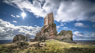 Rock formation sun clouds grass - romanesque free wallpaper