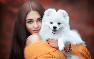 Woman white dog smiling red - a red background behind her free wallpaper