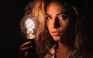 Woman lightbulb serious portrait photorealistic - free light wallpaper