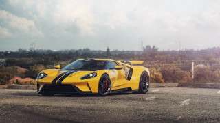 Yellow sports car forest sky - the background and a sunbeam free wallpaper