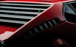 Red sports car black grill - a red sports car free wallpaper