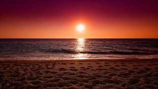 Sunset ocean bright orange sun 2 - a sunset over the ocean free wallpaper