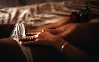 Woman rose tattoo blurry closeup 2 - a rose free wallpaper