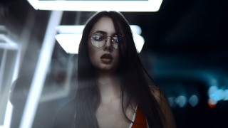 Woman glasses dark room neon - a neon light behind her free wallpaper