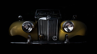 Yellow car headlights dark photorealism - a yellow car free wallpaper