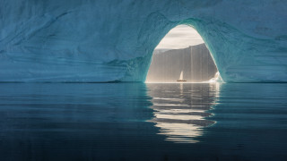 Boat iceberg lighthouse ocean scenery - free ship wallpaper