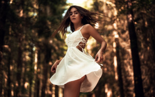 Woman white dress running woods - the wind free wallpaper