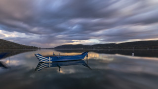 Boat water cloudy sky mountains 6 - constantine andreou free wallpaper