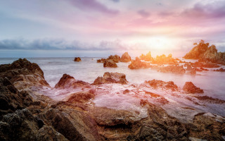 Rocky beach sunset water mountains - rock free wallpaper