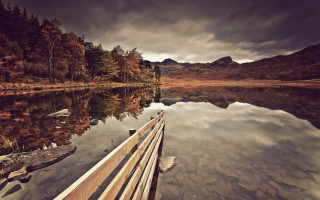 Lake mountains bench sky reflections - a cloudy sky above free wallpaper
