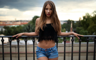 Woman balcony city blurry model - a balcony free wallpaper