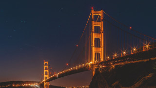Bridge city lights night milky - a body of water below free wallpaper