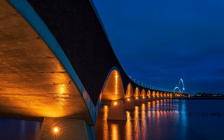 Night lit bridge city sunset - a bridge in the distance free wallpaper