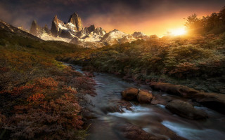 Lush green forest sunset mountains - dramatic free wallpaper