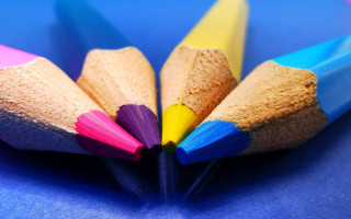 Colored pencils blue surface background - a childs drawing free wallpaper