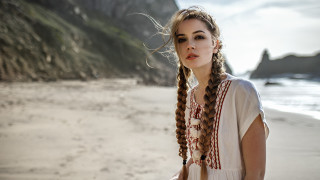 Woman braids beach ocean cliff - a cross stitch free wallpaper