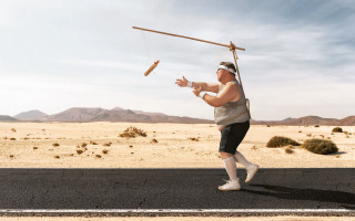 Man balancing pole beach desert - artur tarnowski free wallpaper