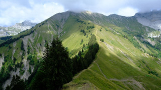Mountain greenfield trees clouds nature - a green field and trees free wallpaper