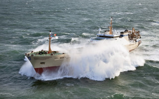 Large boat wave ocean flag 3 - promotional image free wallpaper