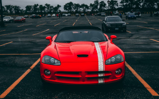 Red sports car white hood - a parking lot free wallpaper