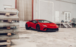 Red sports car building staircase - a staircase in the background free wallpaper
