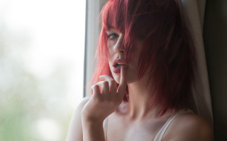 Red hair woman looking out - her finger free wallpaper
