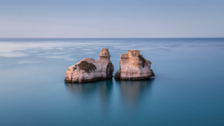 Ocean rock formation beach sky - exekia free wallpaper