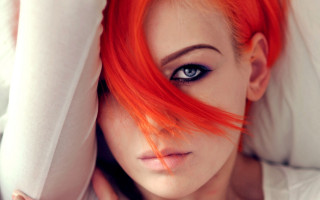 Red hair woman bed closeup - a pillow free wallpaper
