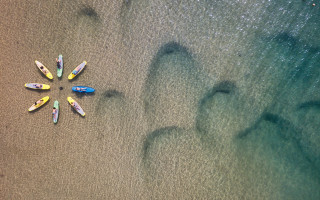 Surfboards beach ocean footprints land - sandy free wallpaper