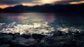 Rock beach water cloudy sky - deep depth of field free wallpaper