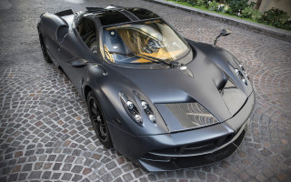 Black sports car cobblestone city - art deco free wallpaper