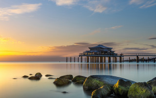 Pier building sunset rocks water - the foreground and a body of water free wallpaper