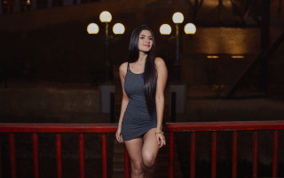 Woman balcony red railing night - egyptian art free wallpaper