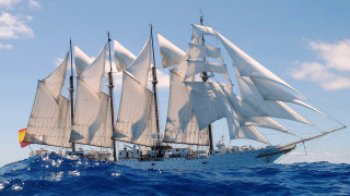 Sailboat ocean sunny day clouds 2 - a sailboat free wallpaper