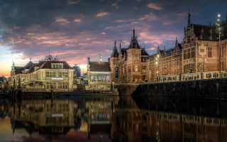 Clock tower building water night - a cloudy sky free wallpaper