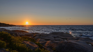 Sunset ocean rocky shore lighthouse - anne rigney free wallpaper