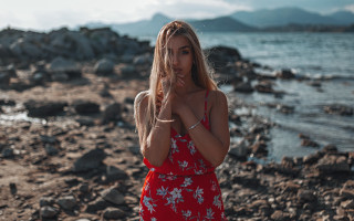 Woman red dress beach portrait - a rocky beach free wallpaper