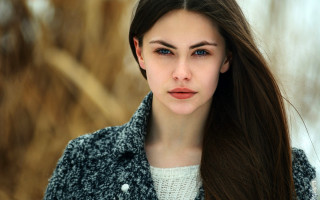Woman long hair serious portrait 5 - her face and shoulders free wallpaper