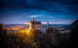 Castle city lights night mountains - tree below free wallpaper