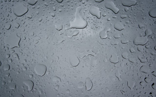 Water droplets glass rain photorealism - a white background free wallpaper