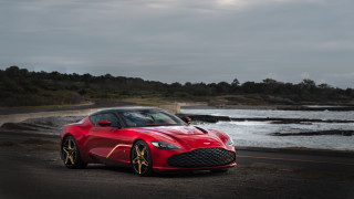Red sports car ocean road - 4k uhd image free wallpaper