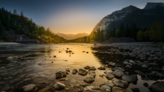 River rocks trees sunset mountains - a mountain in the distance free wallpaper