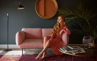 Pink couch woman flowers barefoot - bright studio setting free wallpaper