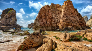 Rocky beach people rocks sky - a rocky beach free wallpaper