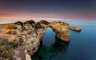 Large rock formation bridge landscape - a bridge in the middle of it free wallpaper