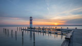 Lighthouse pier sunset clouds water 2 - a pier free wallpaper