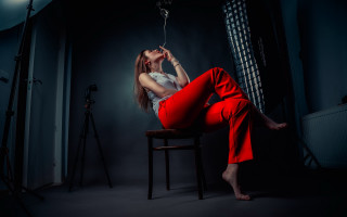 Woman red pants chair dark - red pants free wallpaper