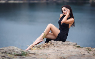 Woman sitting lake black dress - elegant pose free wallpaper