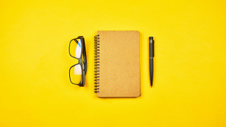 Notebook pen glasses yellow background - glass free wallpaper