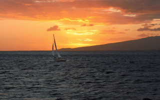 Sailboat ocean sunset mountain cloudy - a sailboat free wallpaper